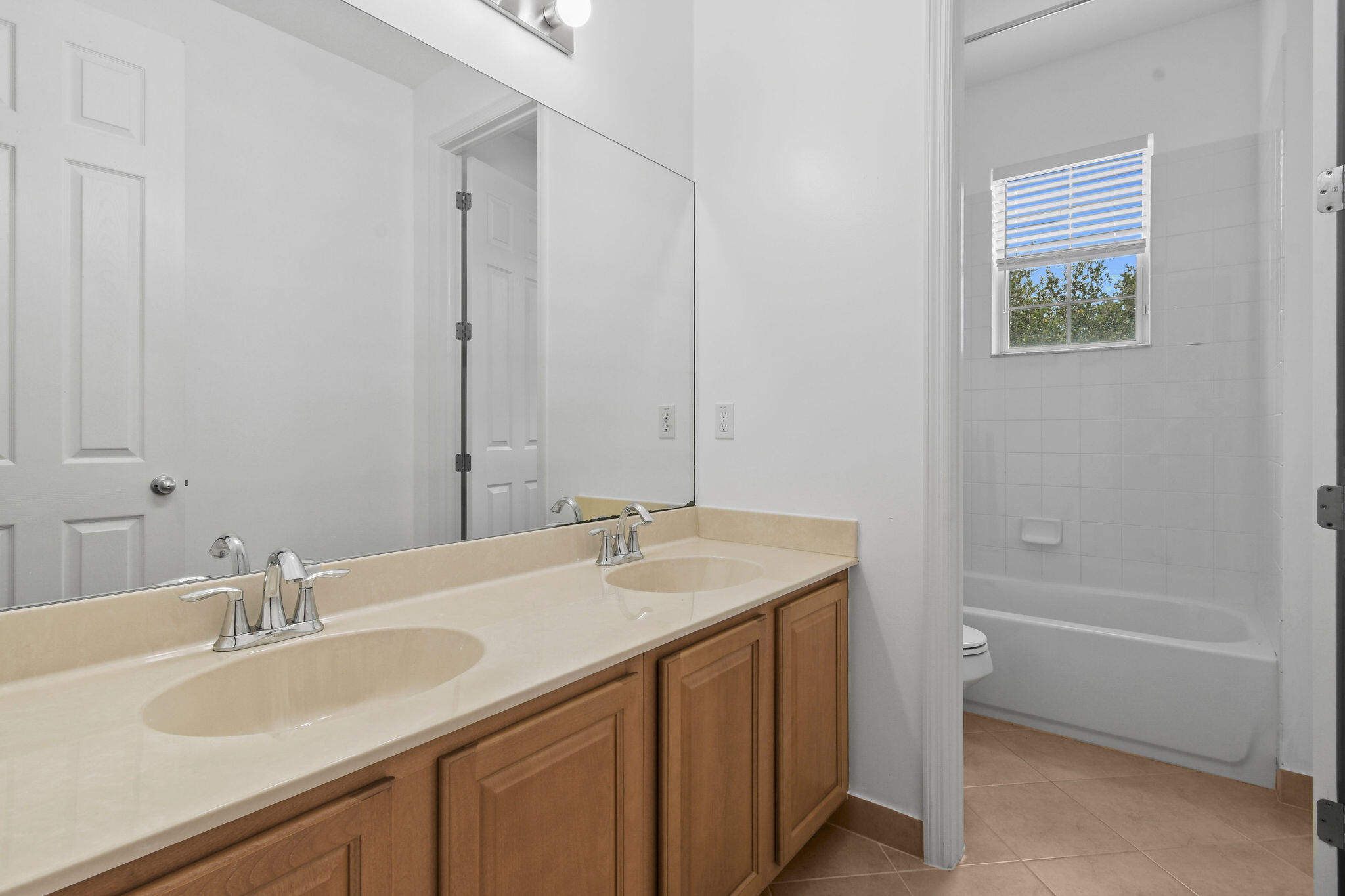 111 Tullamore Avenue Jupiter, FL 33458 - Photo 38 of 63 a bathroom with a sink double vanity granite tub and a mirror