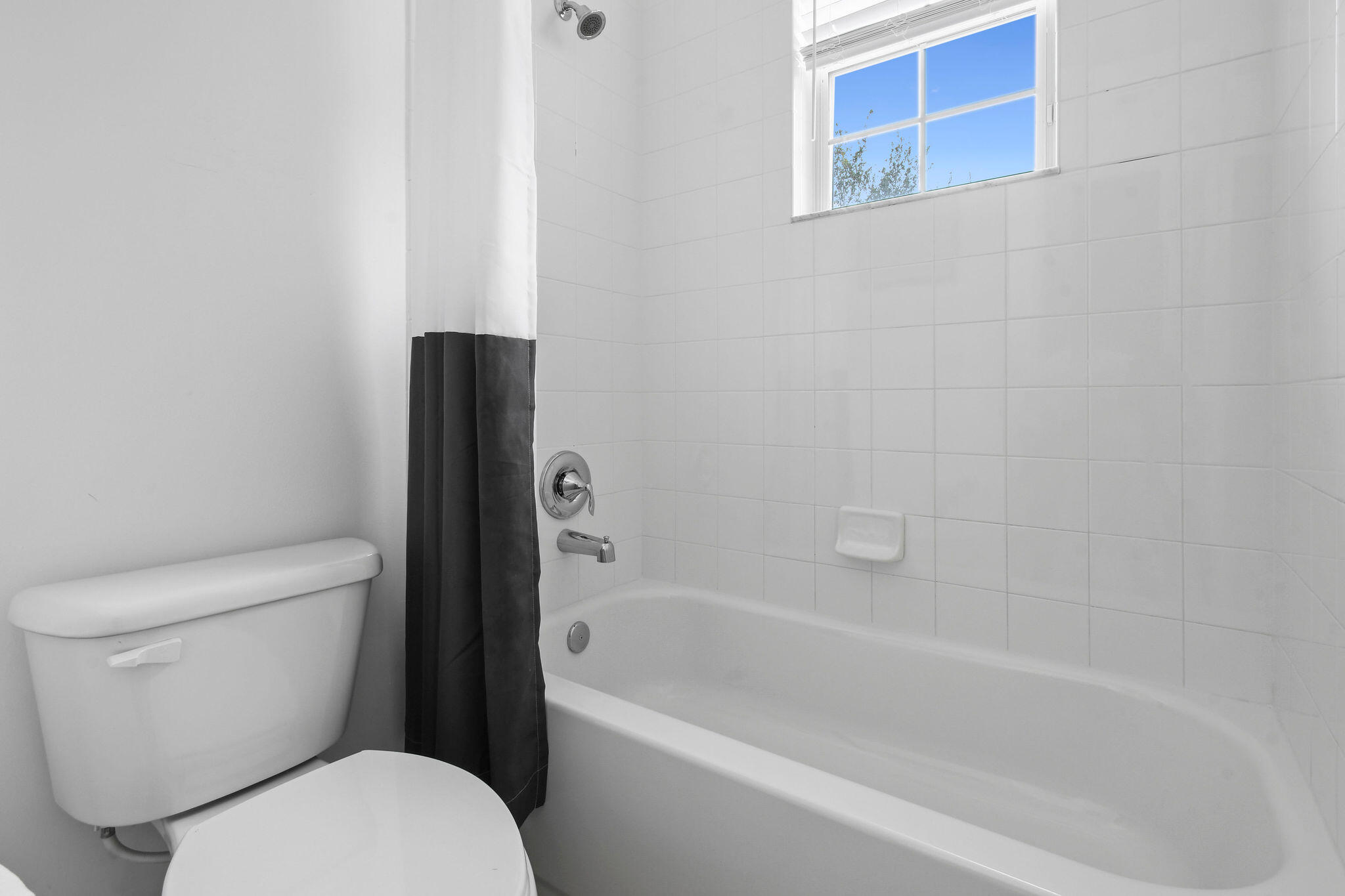111 Tullamore Avenue Jupiter, FL 33458 - Photo 39 of 63 a white toilet sitting next to a bath tub