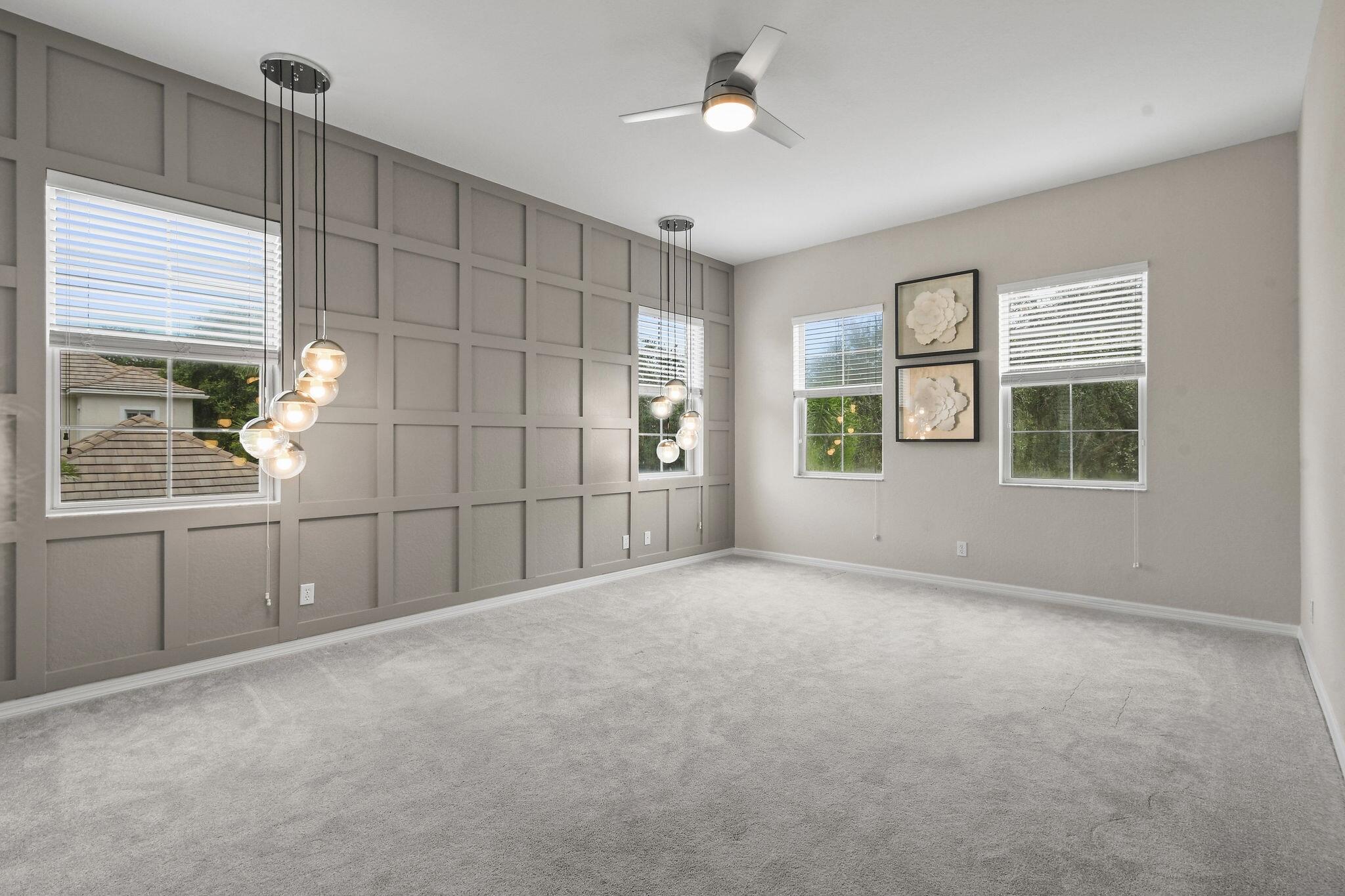 111 Tullamore Avenue Jupiter, FL 33458 - Photo 40 of 63 a view of a livingroom with furniture and windows