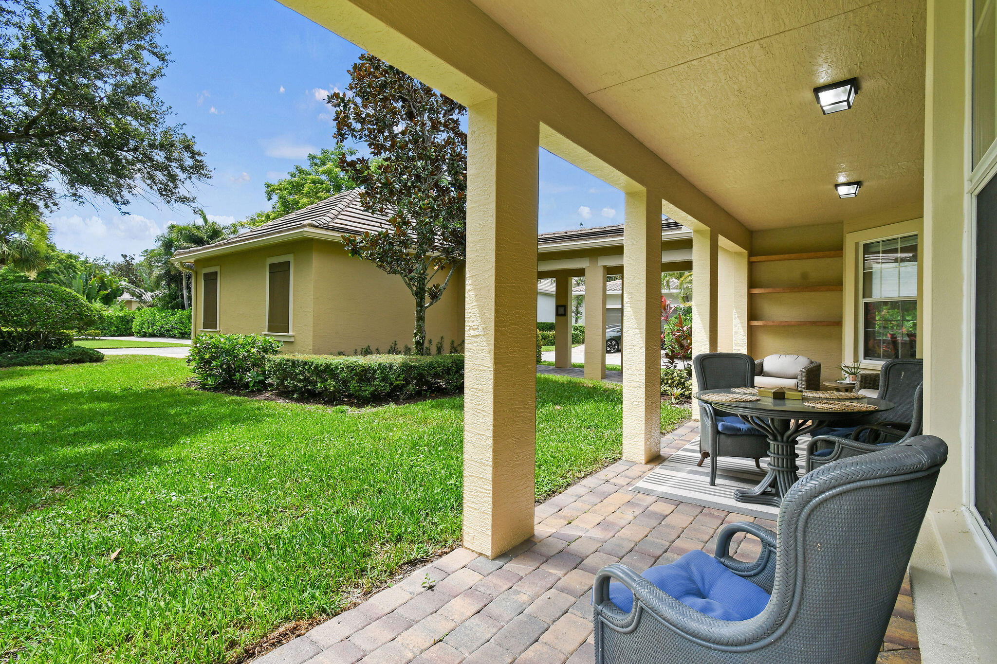 111 Tullamore Avenue Jupiter, FL 33458 - Photo 48 of 63 a house view with a seating space and garden