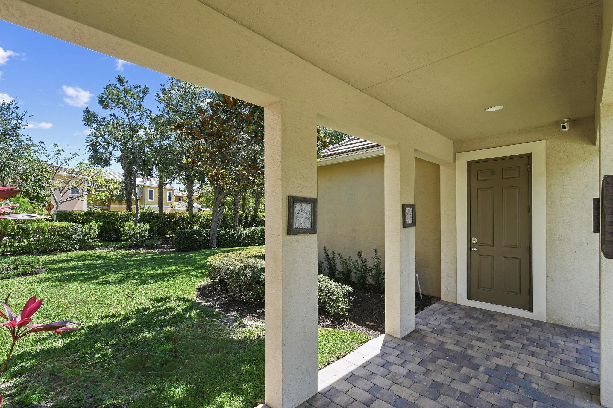 111 Tullamore Avenue Jupiter, FL 33458 - Photo 49 of 63 a view of a porch with a yard
