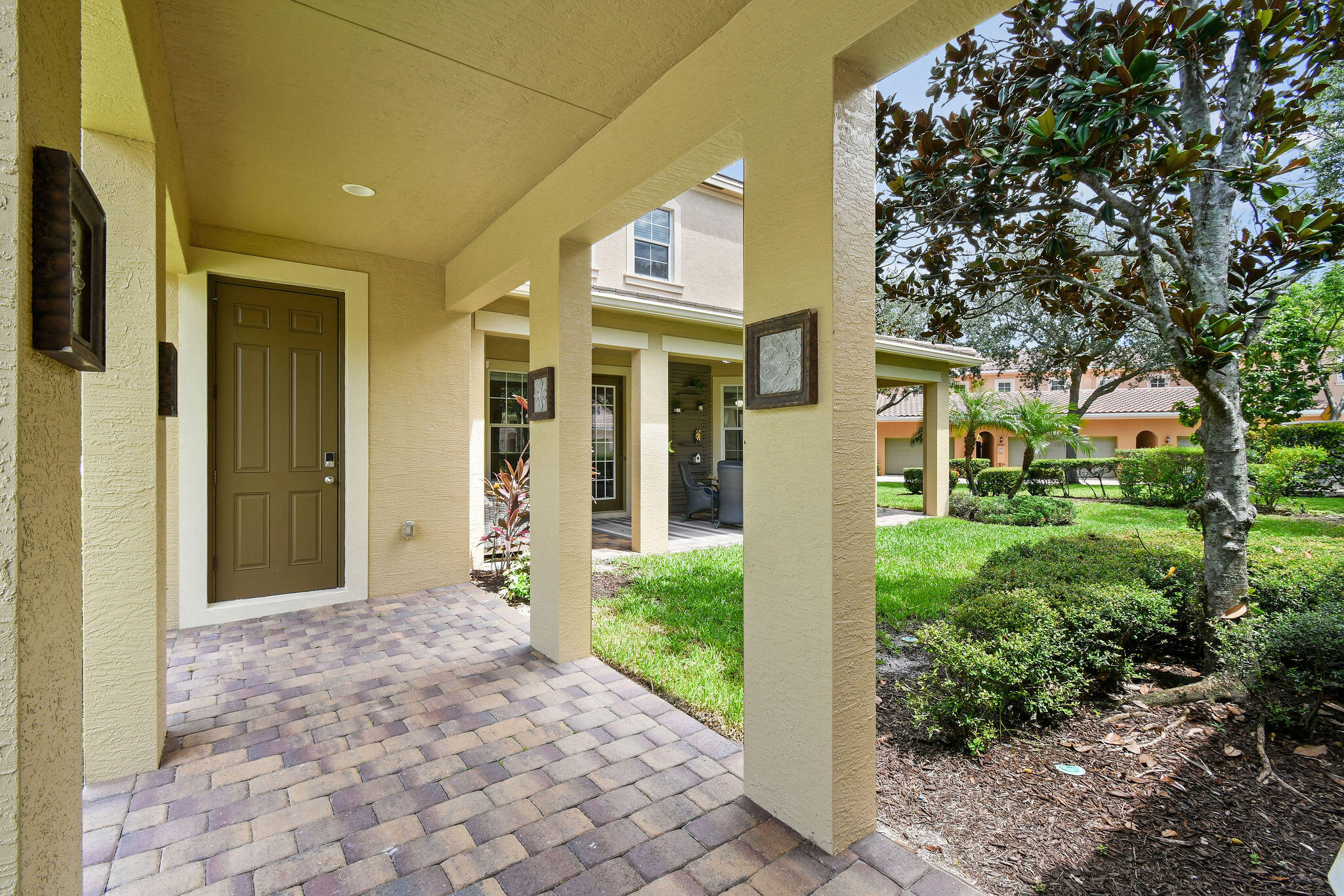 111 Tullamore Avenue Jupiter, FL 33458 - Photo 50 of 63 a front view of a house with a yard