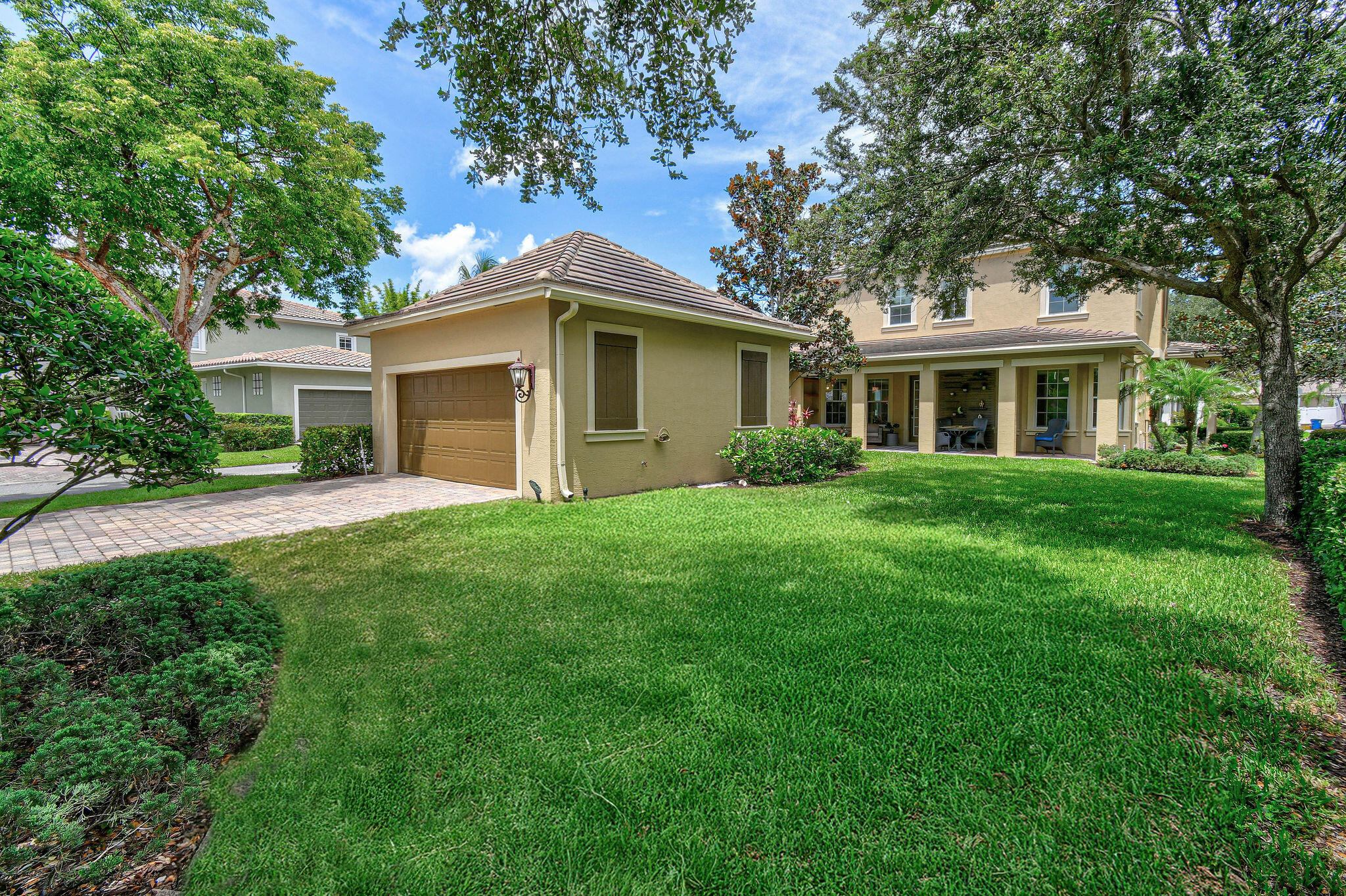 111 Tullamore Avenue Jupiter, FL 33458 - Photo 54 of 63 a front view of house with yard and green space