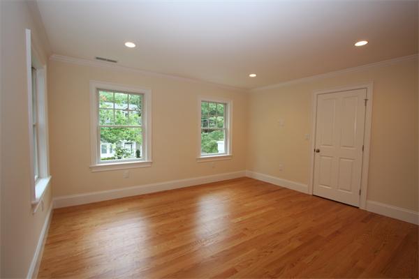 7 Royalston Road Wellesley, MA 02481 - Photo 23 of 30 an empty room with wooden floor and windows