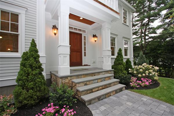 7 Royalston Road Wellesley, MA 02481 - Photo 3 of 30 a front view of a house with flowers and flowers