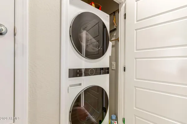 a view of a hallway with washer and dryer