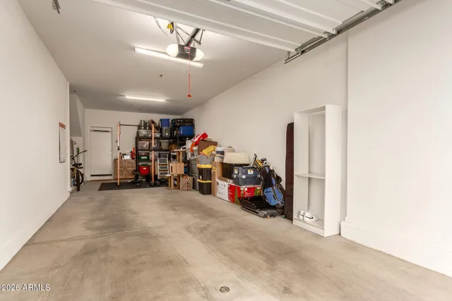 a view of a garage with a bike and car