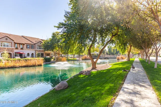 a view of a lake with a house in the background