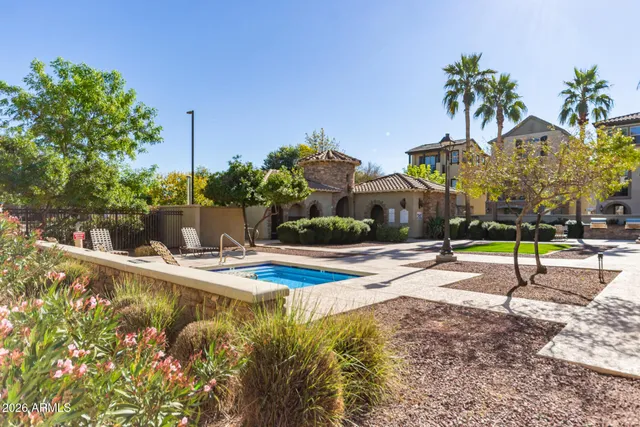 a house with palm tree in front of it