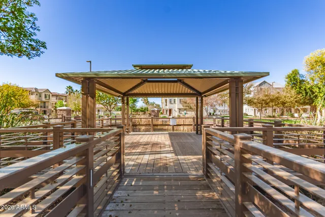 a view of a patio with wooden floor and city view