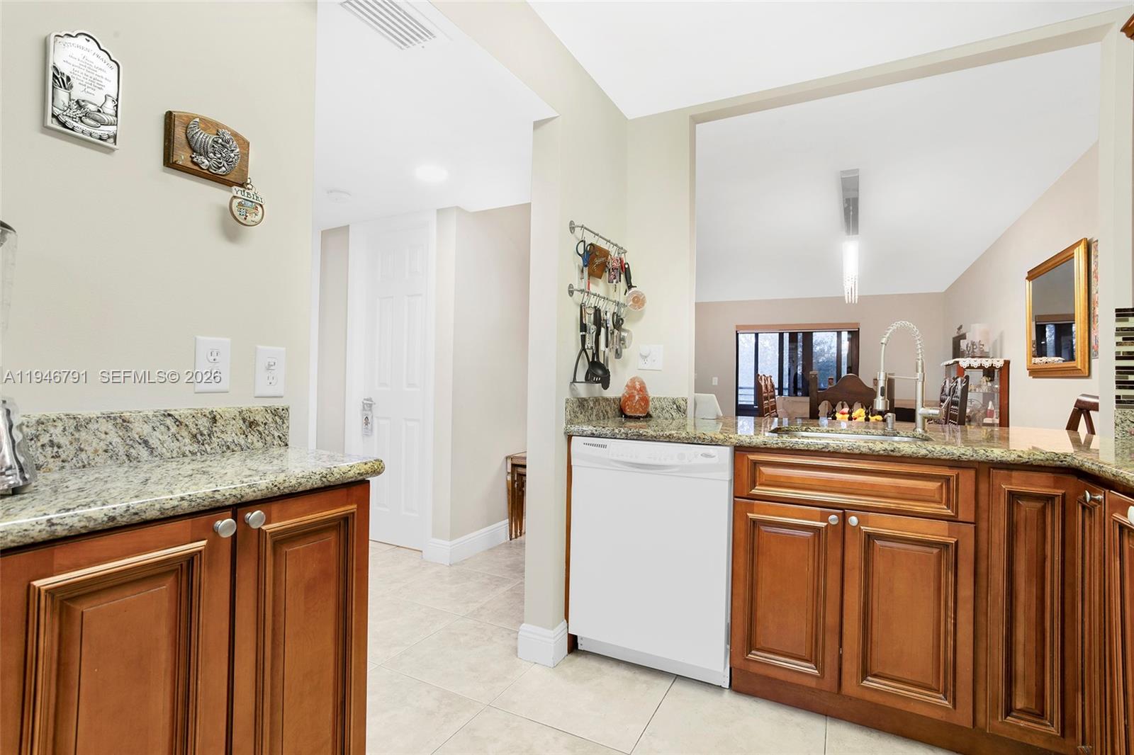2941 North Nob Hill Road, Unit 208 Sunrise, FL 33322 - Photo 25 of 40 a kitchen with cabinets and window