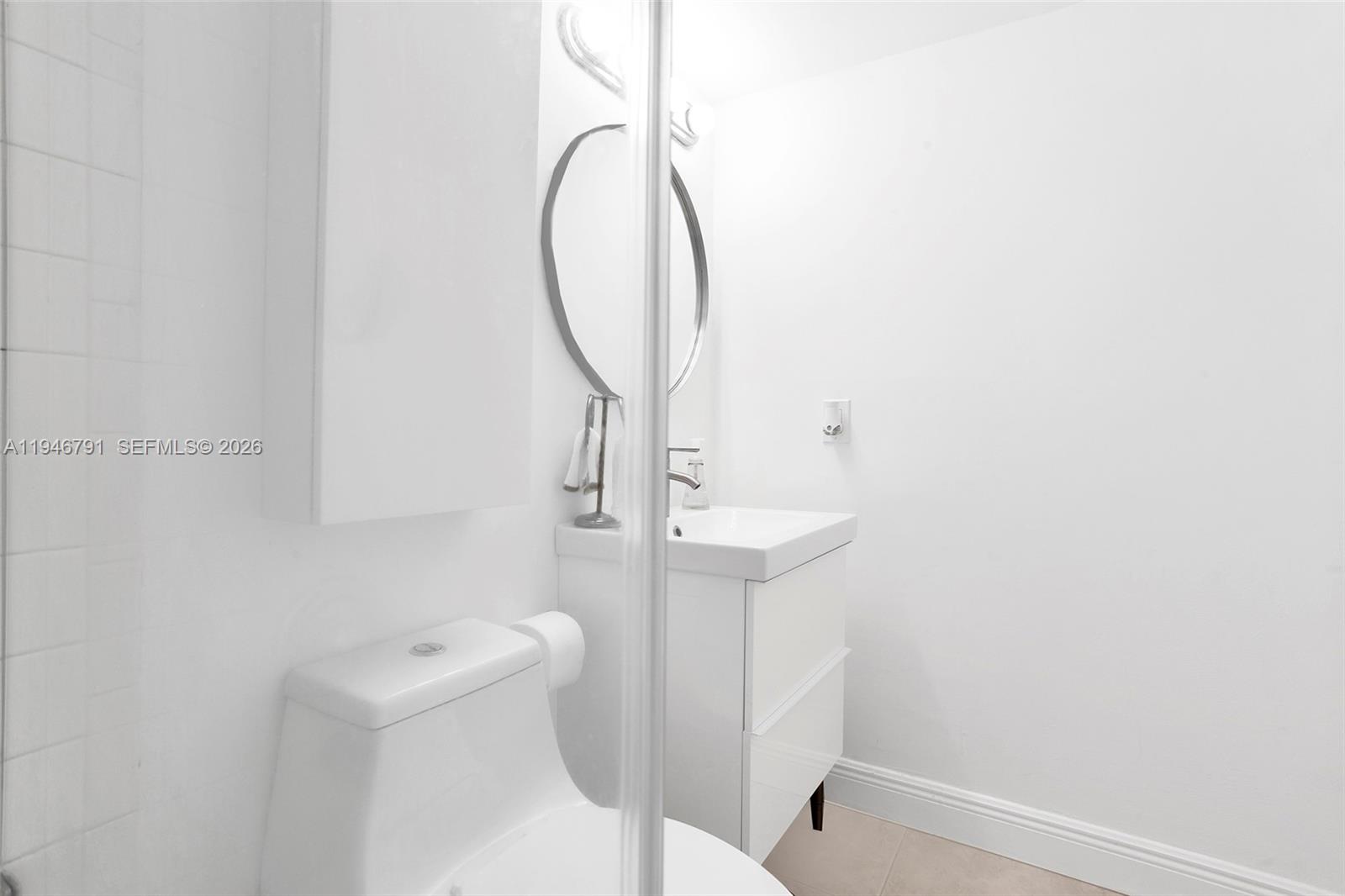 2941 North Nob Hill Road, Unit 208 Sunrise, FL 33322 - Photo 27 of 40 a bathroom with a sink toilet and shower