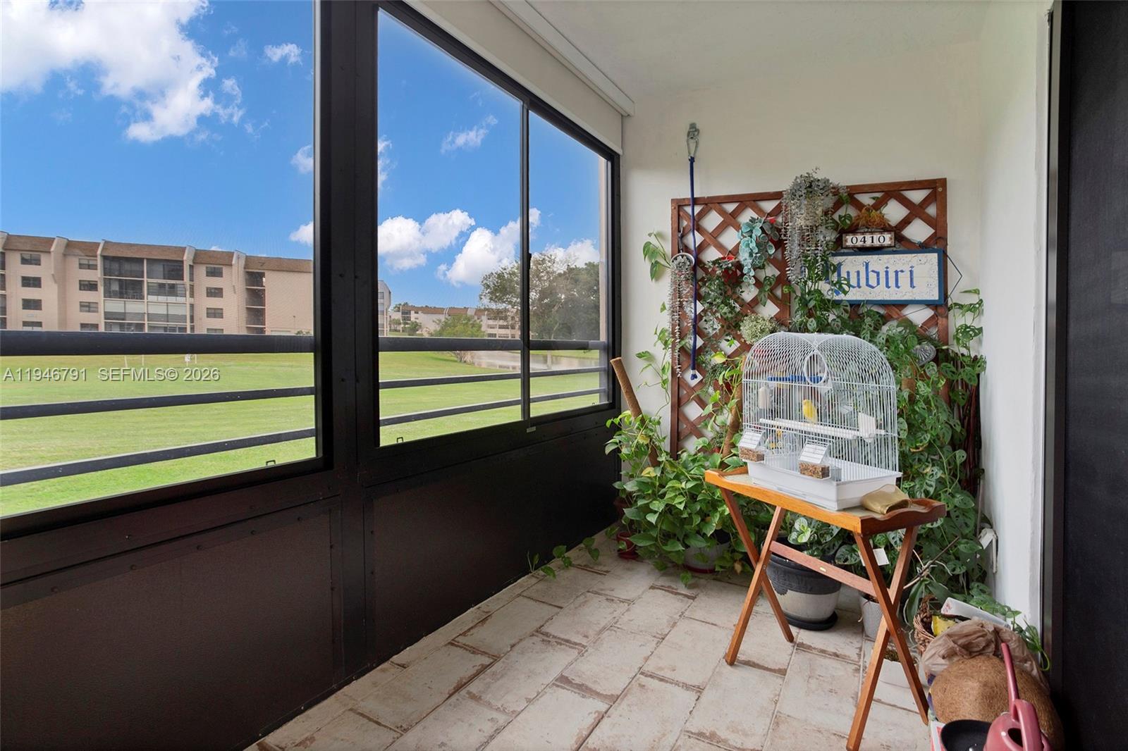 2941 North Nob Hill Road, Unit 208 Sunrise, FL 33322 - Photo 32 of 40 a view of an outdoor seating area