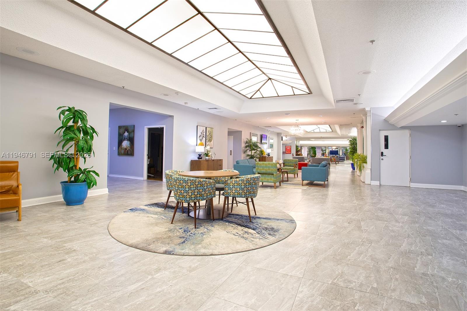2941 North Nob Hill Road, Unit 208 Sunrise, FL 33322 - Photo 35 of 40 a view of a dining room with furniture window and wooden floor