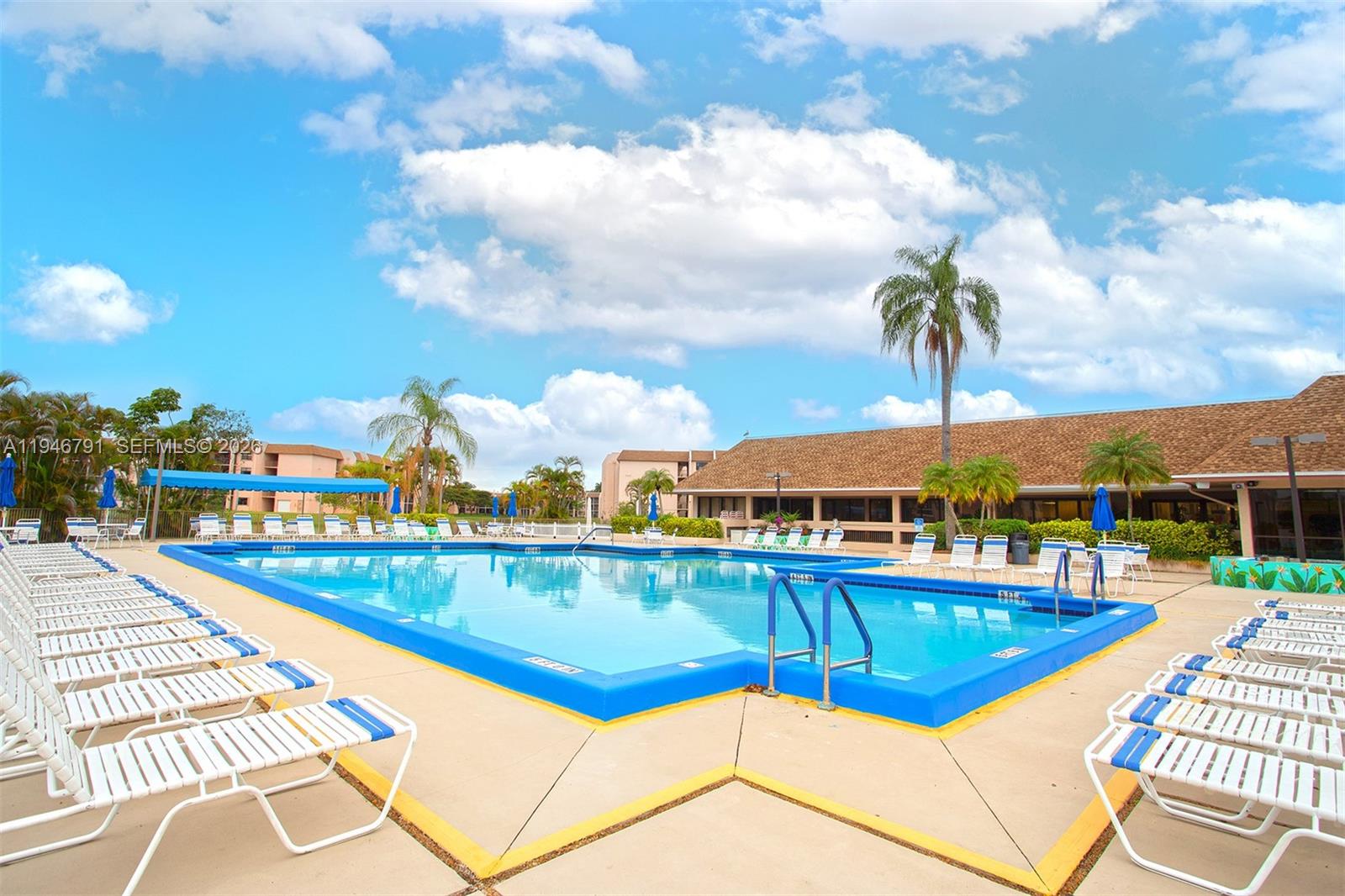 2941 North Nob Hill Road, Unit 208 Sunrise, FL 33322 - Photo 37 of 40 a view of a swimming pool with seating space