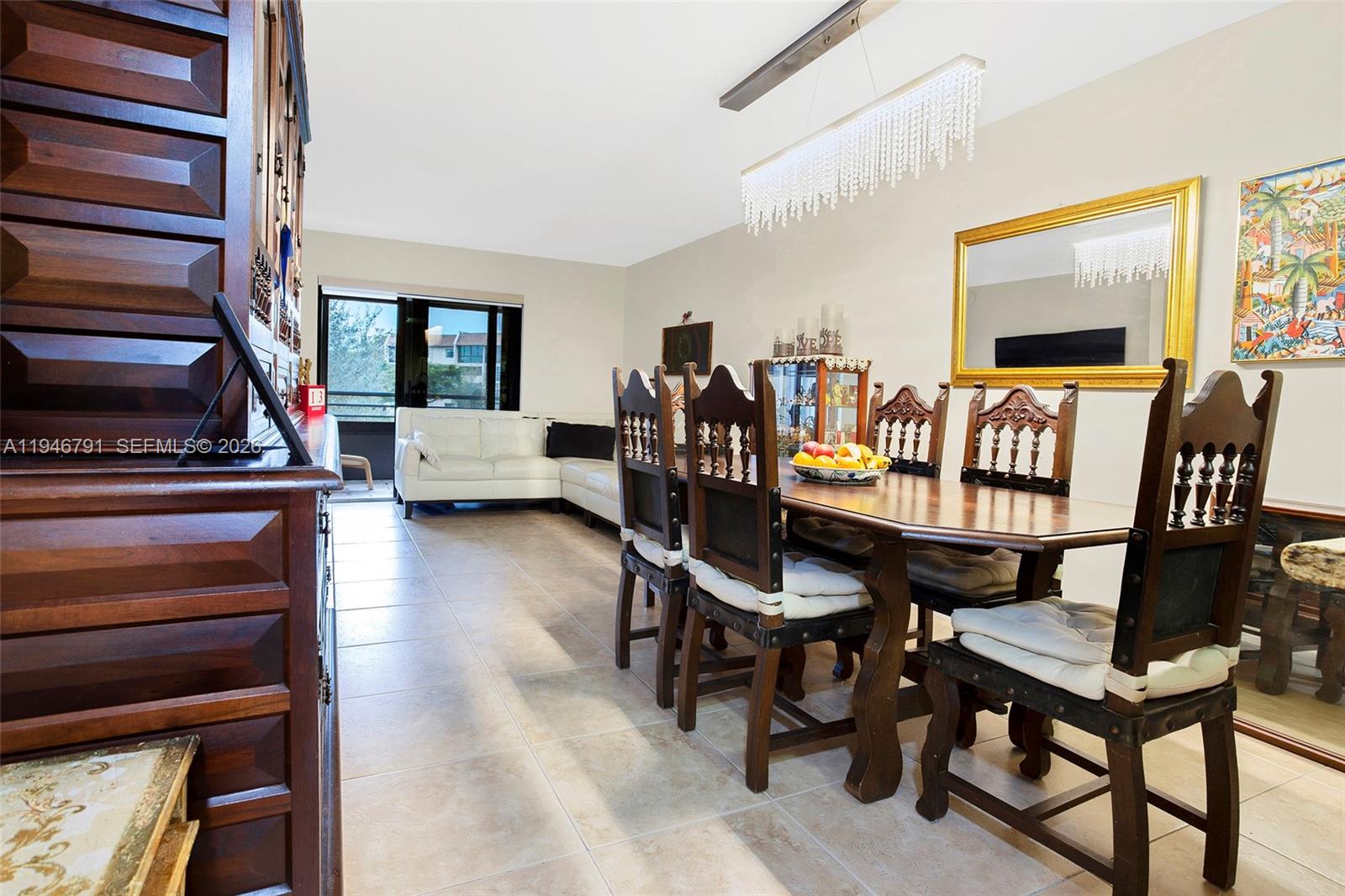 2941 North Nob Hill Road, Unit 208 Sunrise, FL 33322 - Photo 8 of 40 a living room with furniture and a flat screen tv