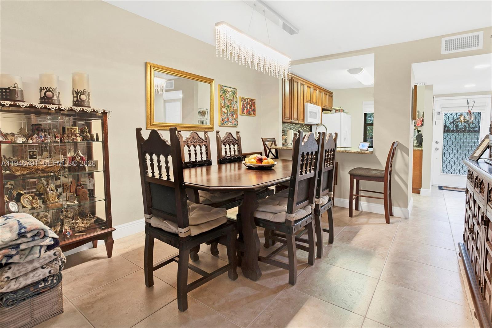 2941 North Nob Hill Road, Unit 208 Sunrise, FL 33322 - Photo 10 of 40 a dining room with furniture and wooden floor