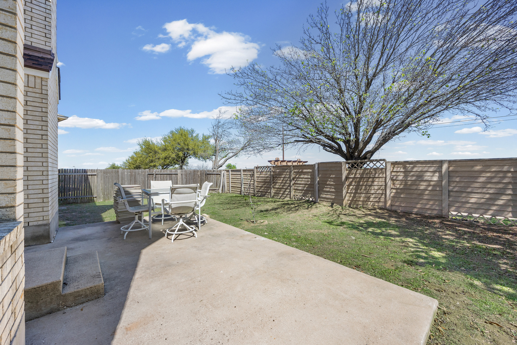 3502 Shiraz Loop Round Rock, TX 78665 - Photo 19 of 23 Fenced backyard with a patio and outdoor dining area