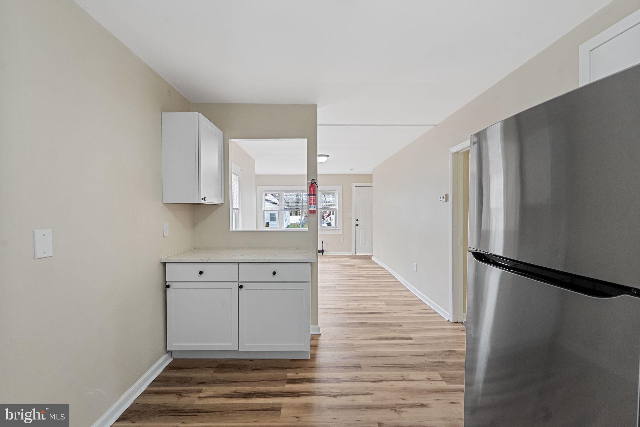 40 Wilson Road Clementon, NJ 08021 - Photo 13 of 31 a view of a kitchen with wooden floor and electronic appliances
