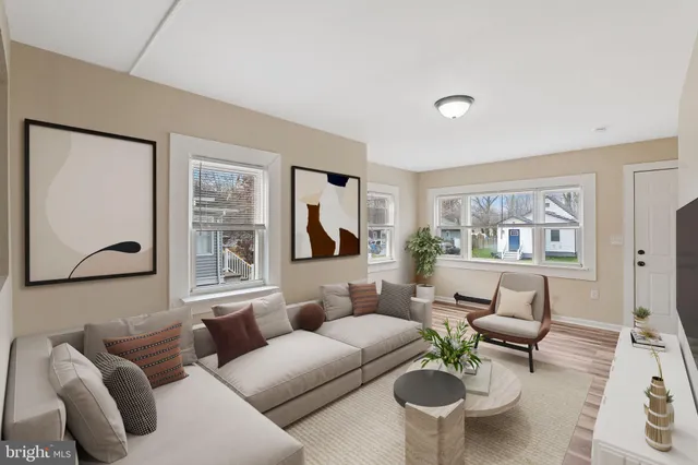 a living room with furniture or couch and a window