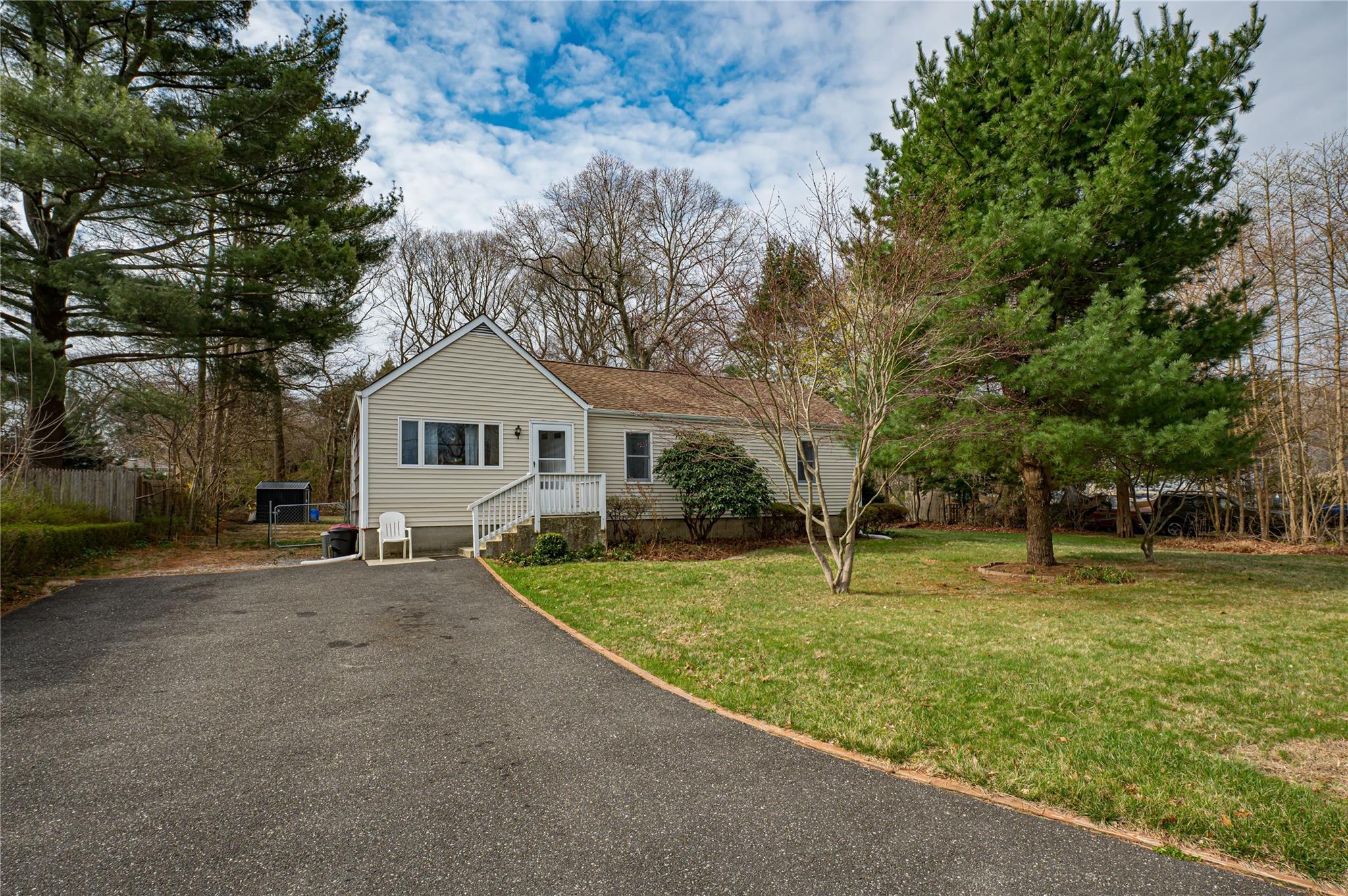 a house with trees in the background