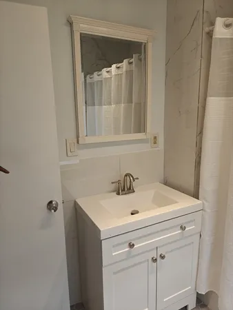 a bathroom with a sink and vanity