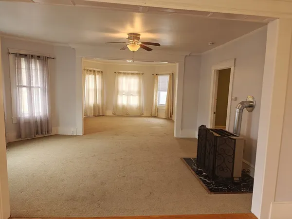 a view of a livingroom with furniture and windows