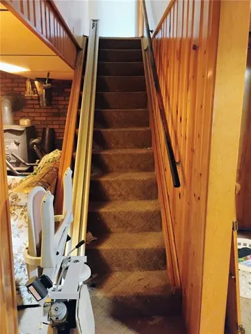 a living room filled with furniture and a window