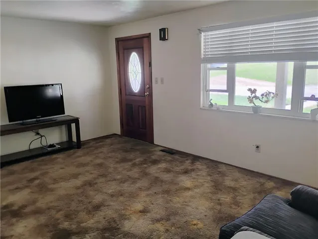 a view of livingroom with furniture and windows