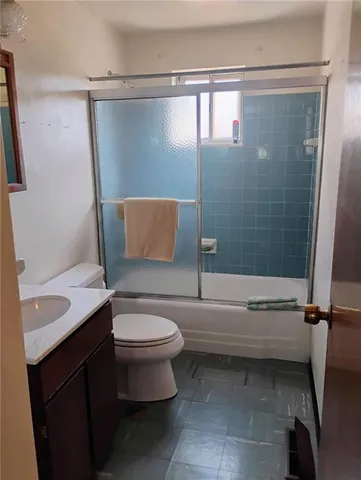 a living room with furniture and a piano