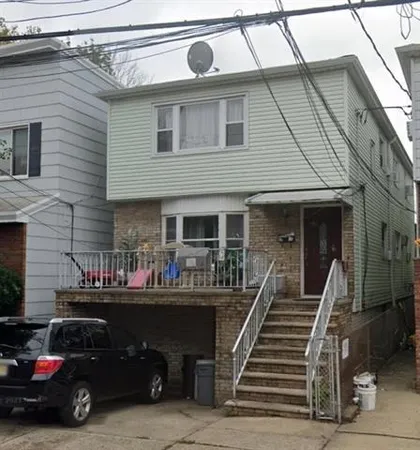 a view of a car park in front of house