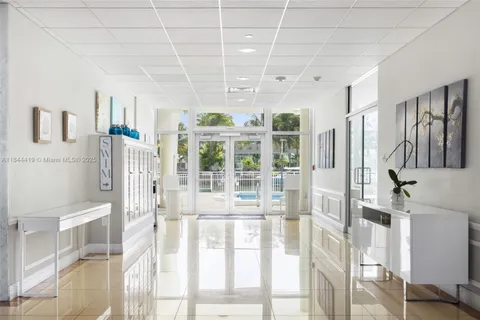 a view of a house with potted plants