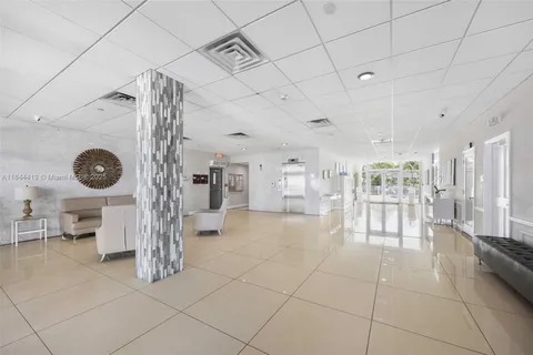 a view of a swimming pool and outdoor seating
