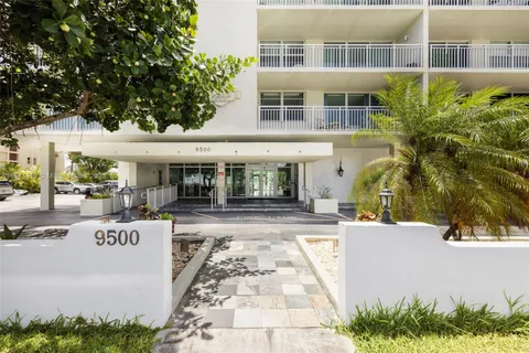 a view of a building with sitting area and tub