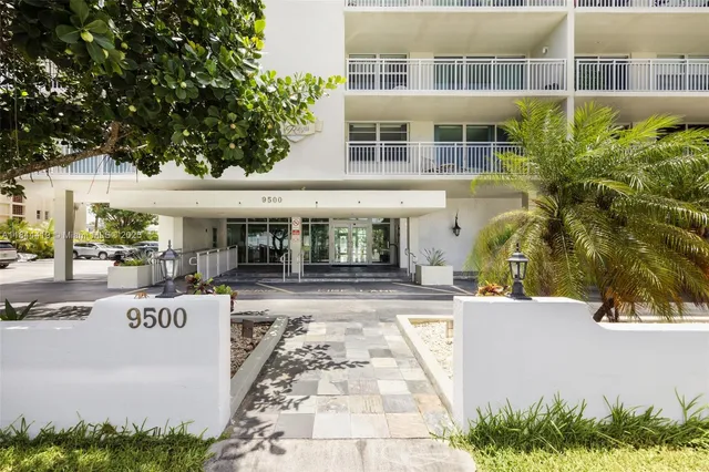 a view of a building with sitting area and tub