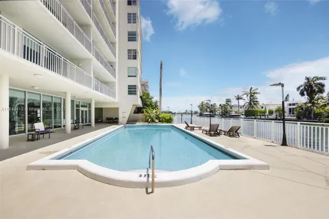 a view of a house with swimming pool and porch