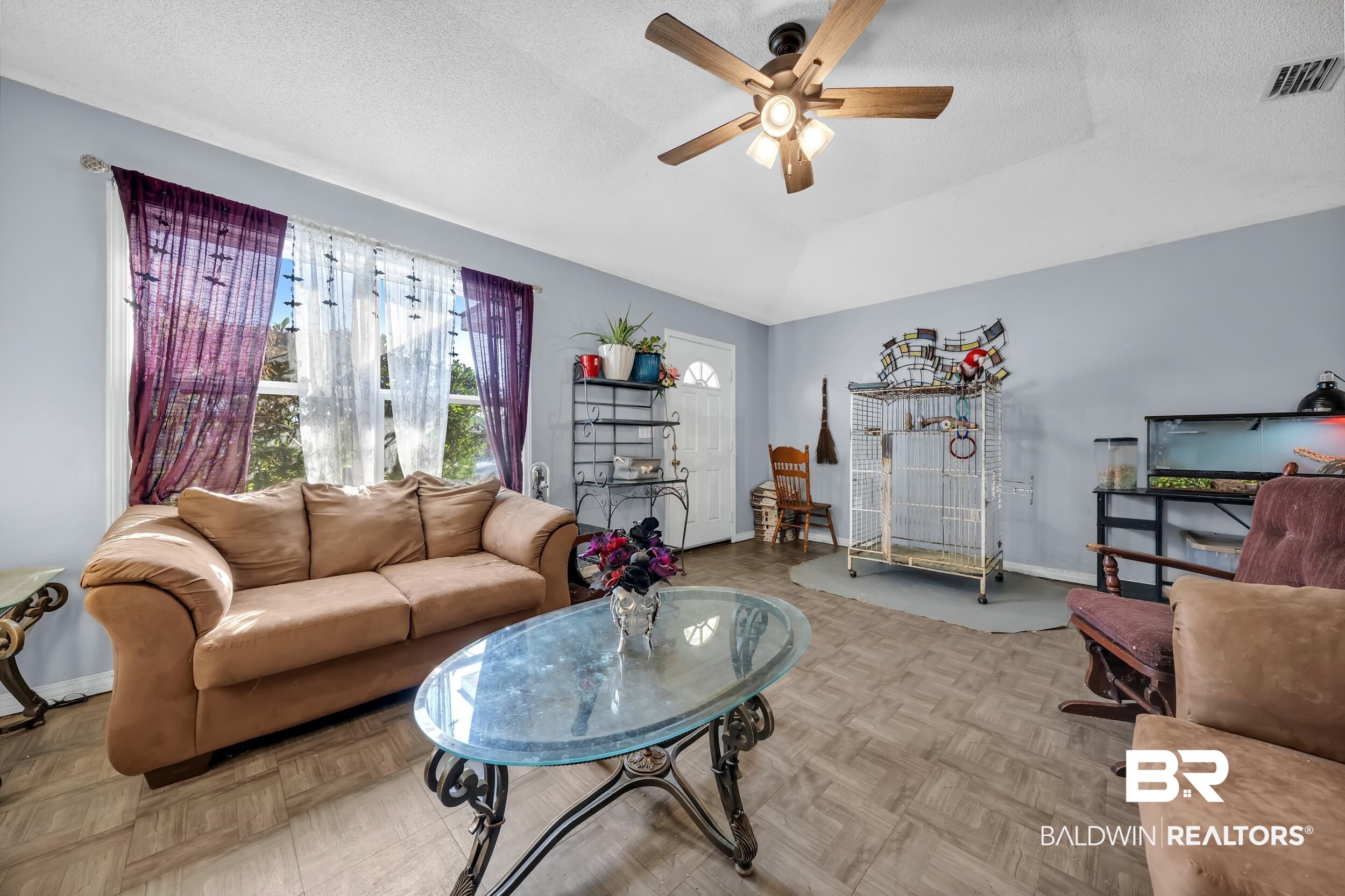 16603 Vanilla Drive Foley, AL 36535 - Photo 3 of 19 Living area with a textured ceiling, a ceiling fan, and lofted ceiling