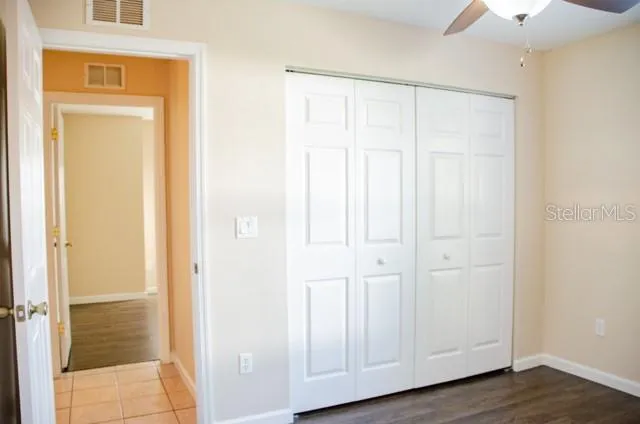 a view of an entryway with wooden floor