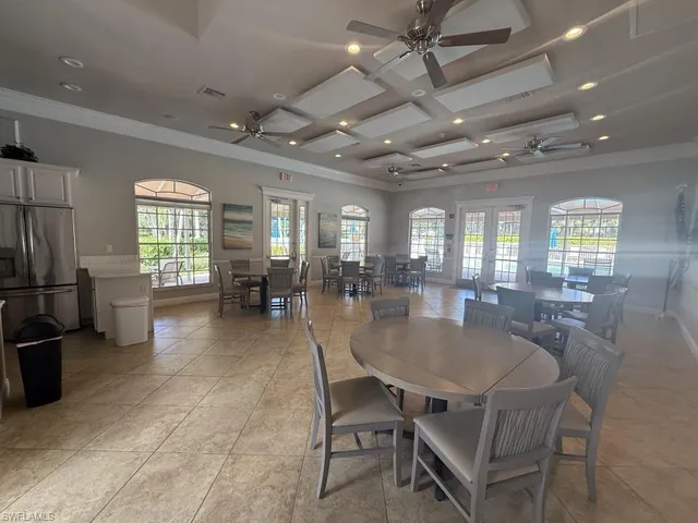 a kitchen with stainless steel appliances a refrigerator and a stove top oven