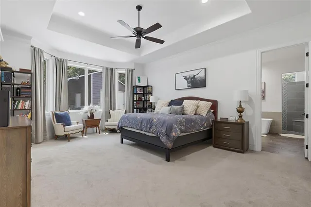 a kitchen with granite countertop a table chairs stove and cabinets