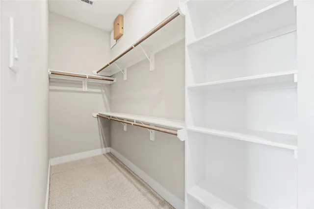 a view of an empty walk in closet