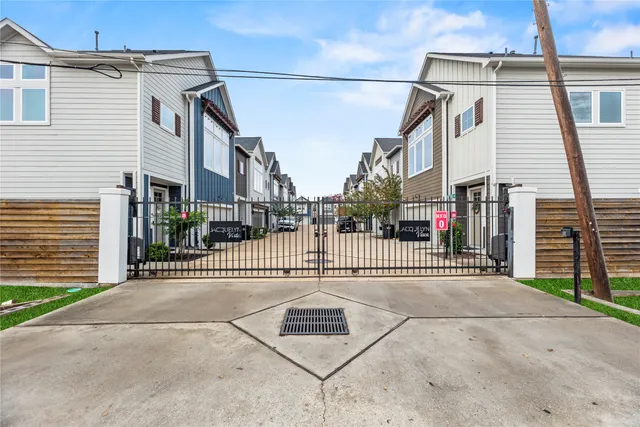 a view of a brick house with a street