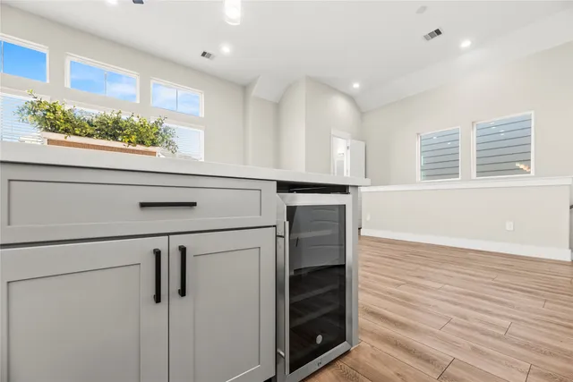 a kitchen with a stove and a refrigerator
