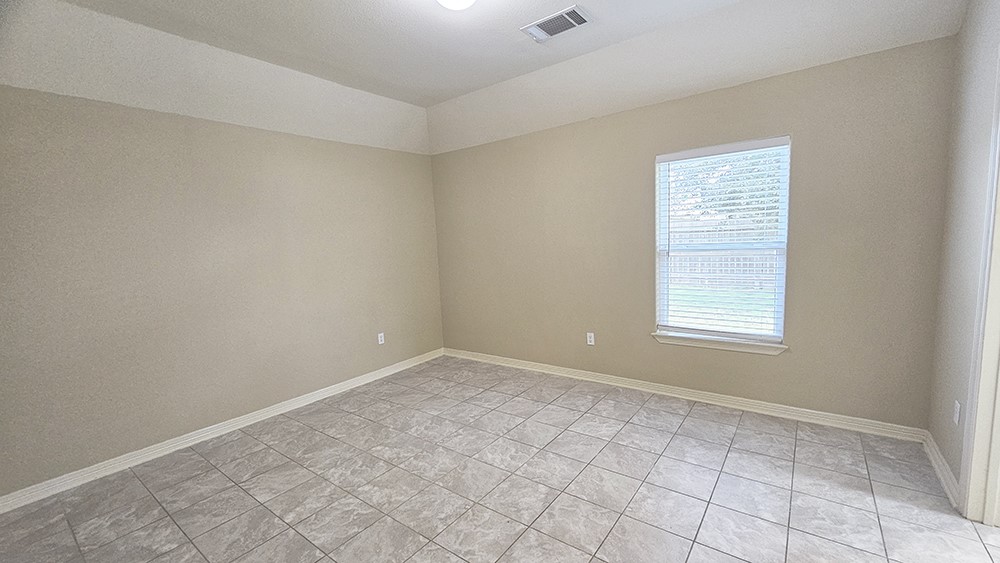 8031 Canyon Street Houston, TX 77051 - Photo 12 of 17 an empty room with windows