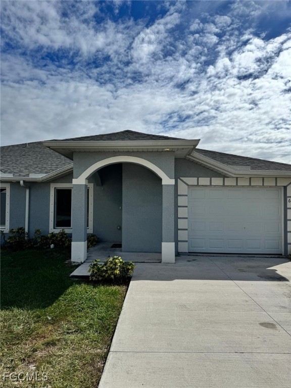 610 Alabama Road South Lehigh Acres, FL 33974 - Photo 12 of 12 a front view of a house with a yard