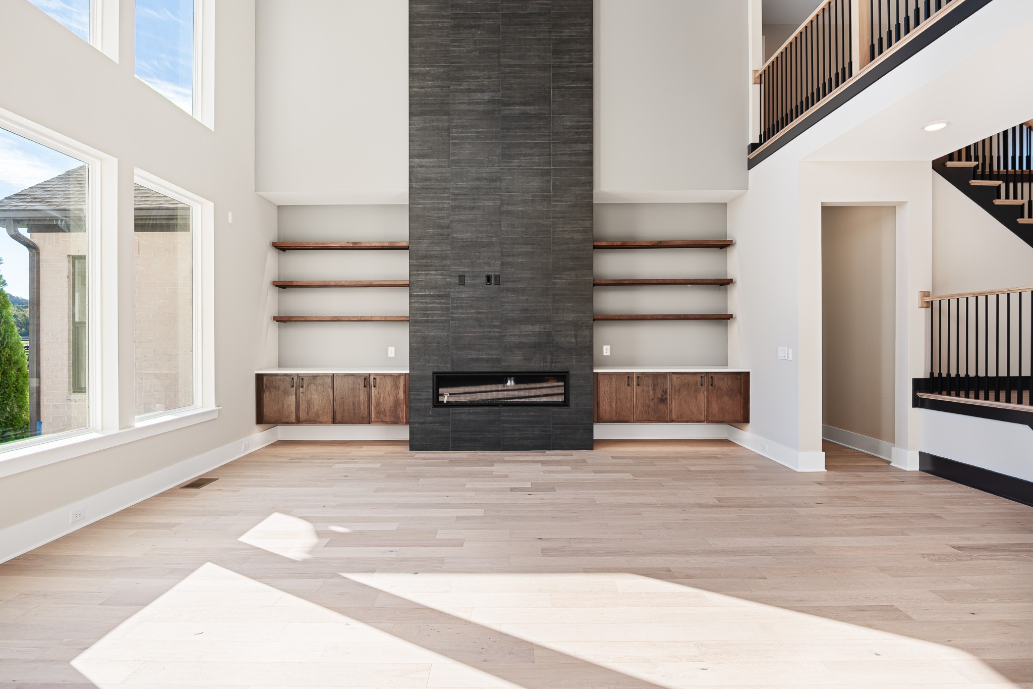 1760 Dean Road Thompson's Station, TN 37179 - Photo 11 of 49 a view of a livingroom with wooden floor and staircase