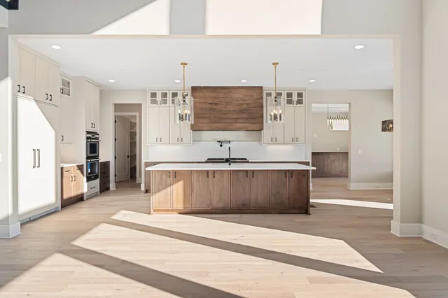 a living room with a couch and a chandelier