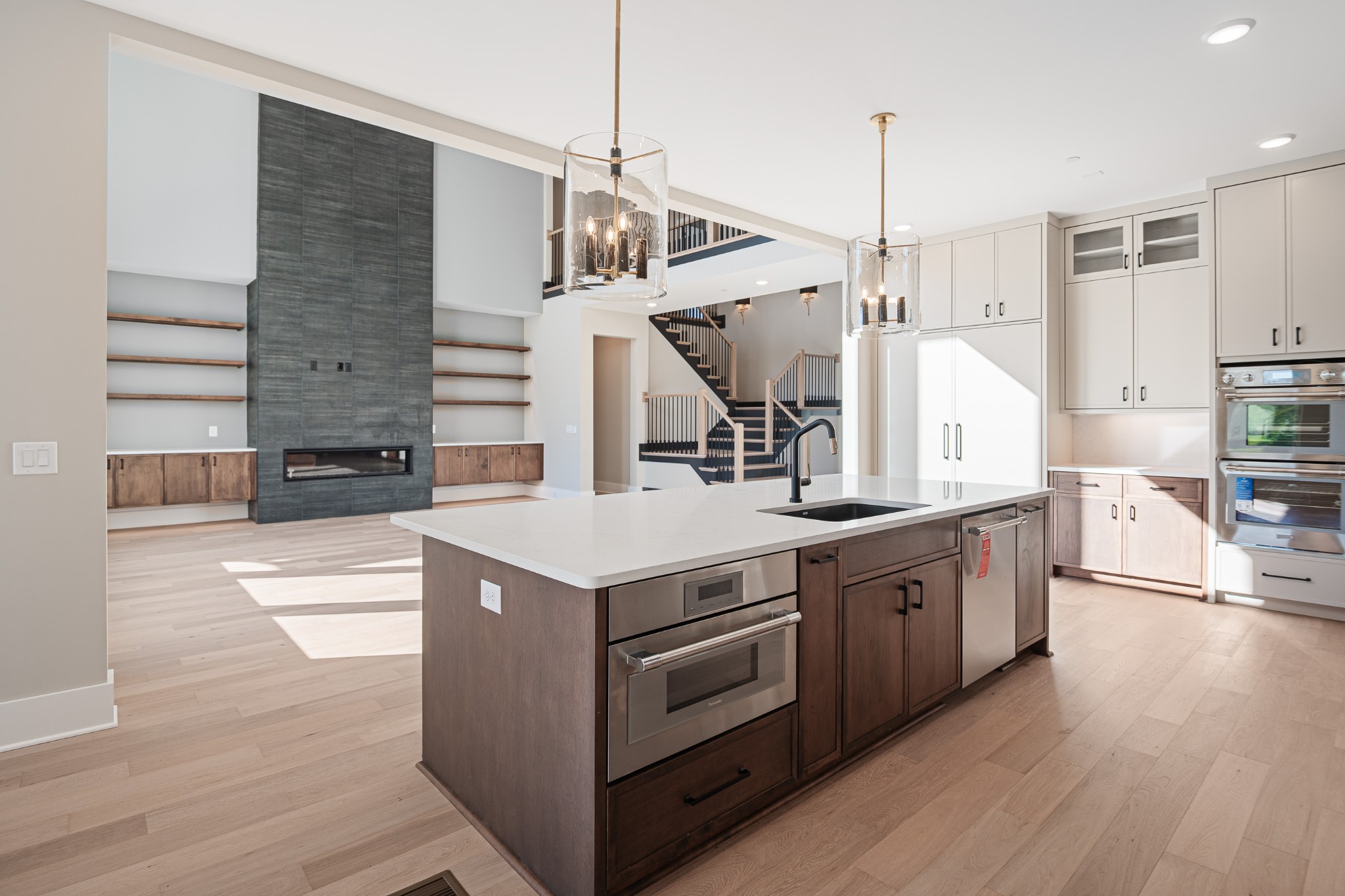 1760 Dean Road Thompson's Station, TN 37179 - Photo 19 of 49 a kitchen with stainless steel appliances granite countertop a sink a stove and a wooden floors
