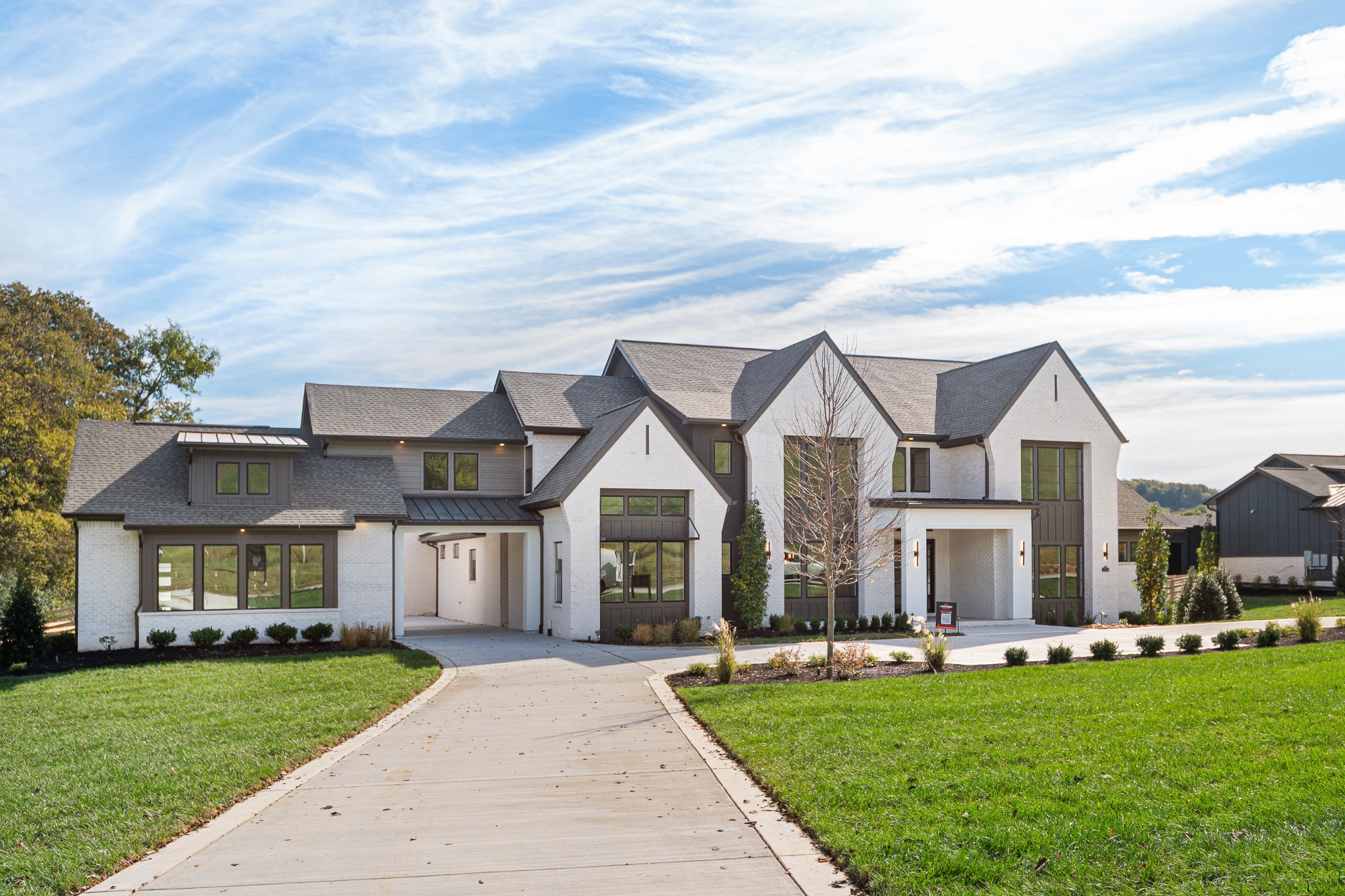 1760 Dean Road Thompson's Station, TN 37179 - Photo 2 of 49 a front view of a house with a garden and porch