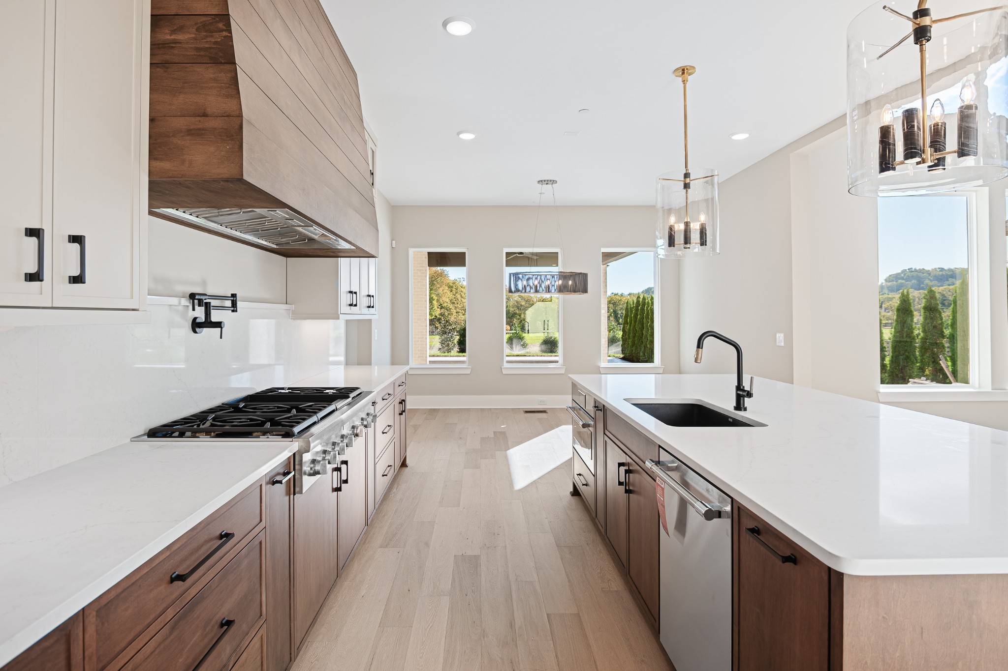1760 Dean Road Thompson's Station, TN 37179 - Photo 21 of 49 a kitchen with granite countertop a sink stove and cabinets